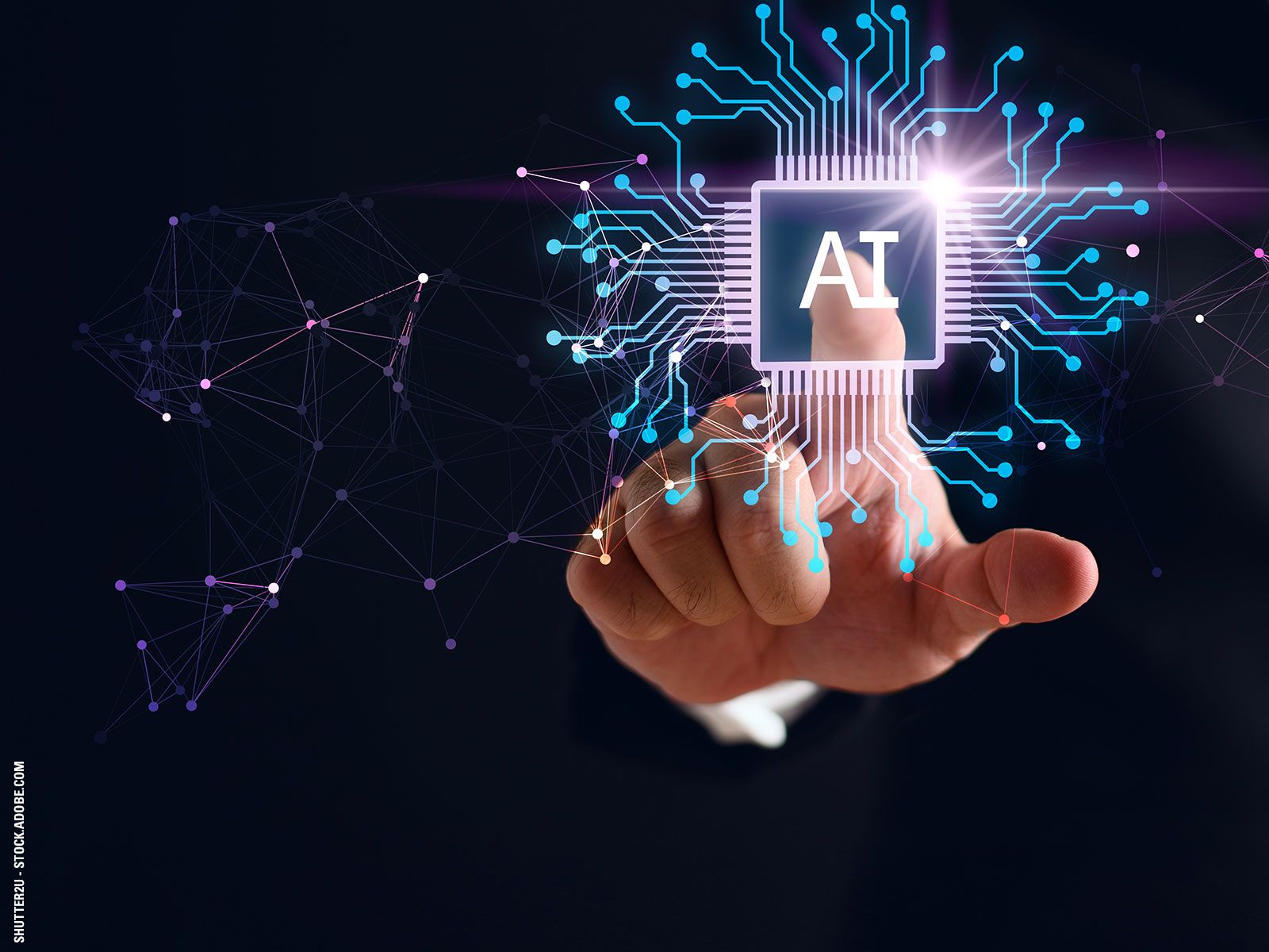 A hand touching a glowing square chip symbol labeled AI, with digital circuit lines and a network of connected nodes expanding outward on a dark background.